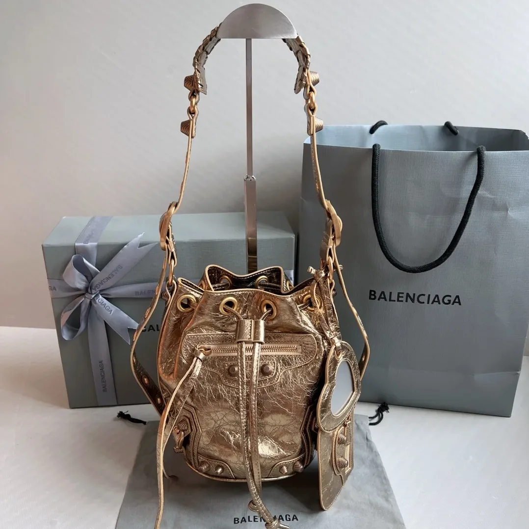 Balenciaga Le Cagole Xs Bucket Bag Metallized With Rhinestones In Gold Tone / Balenciaga Le Cagole Xs Bucket Bag Metallized With Rhinestones In Gold Tone /