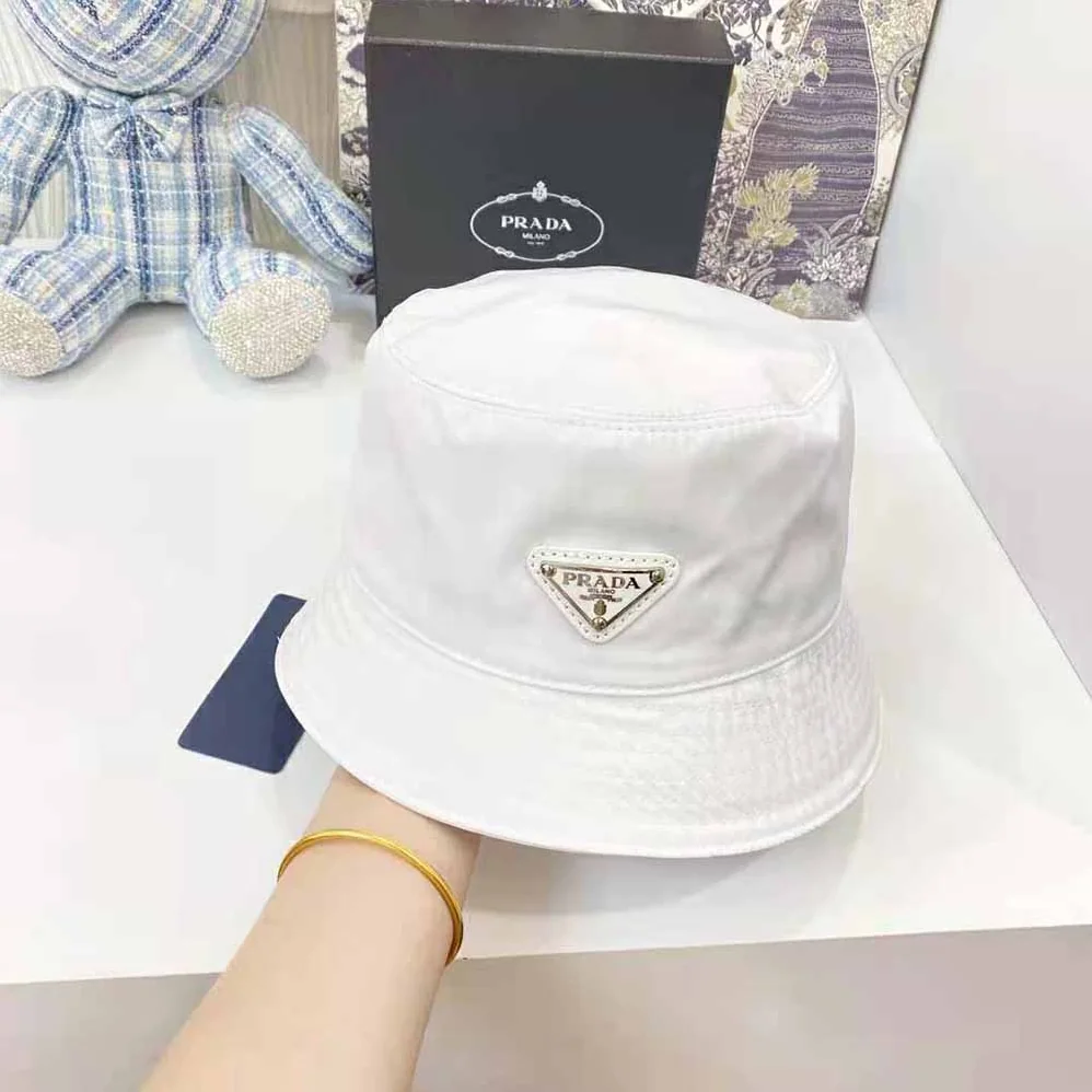 Prada Nylon Bucket Hat Decorated with the Triangle Logo for Women in White Prada Nylon Bucket Hat Decorated with the Triangle Logo for Women in White