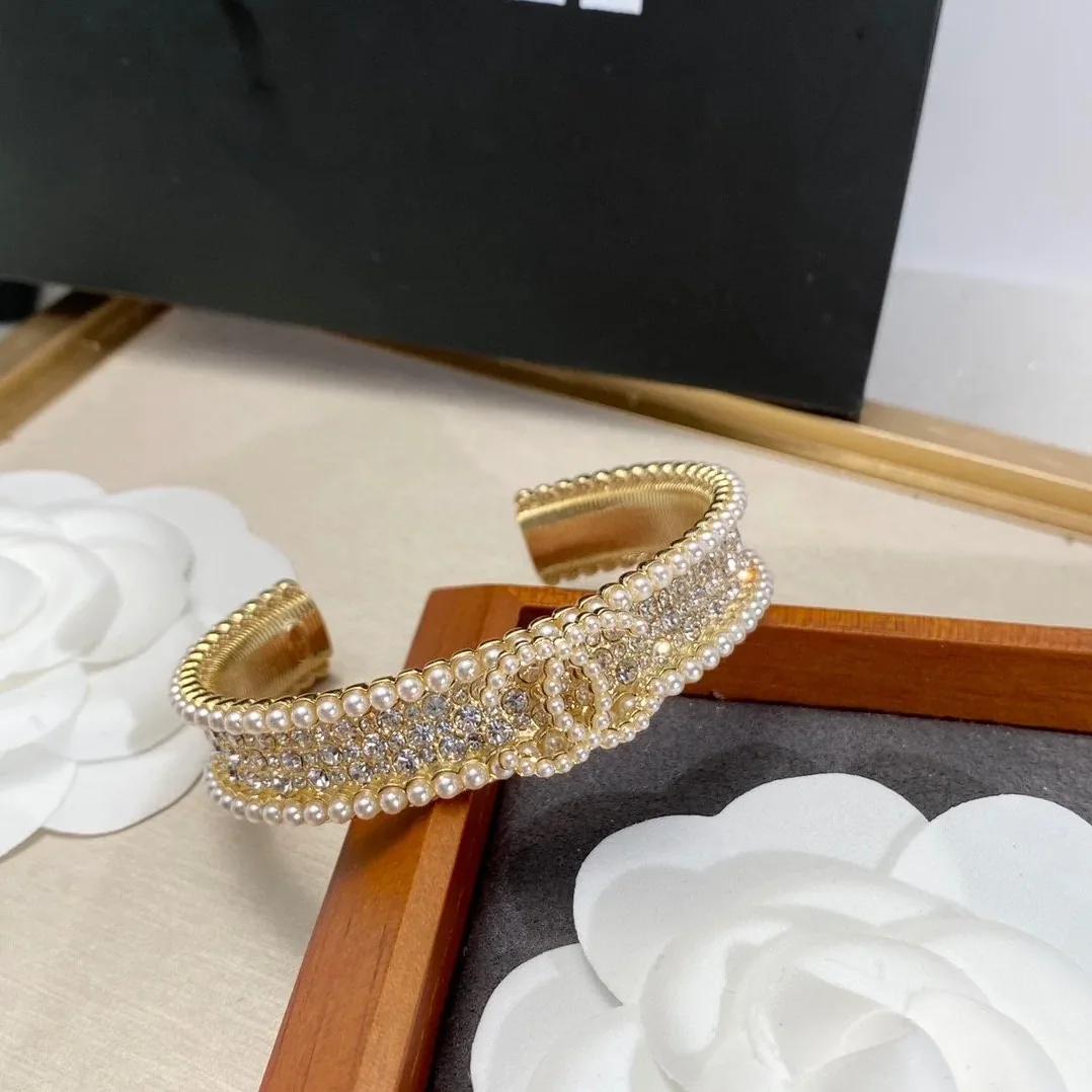 Chanel Pearl And Crystal Interlocking CC Cuff Bracelet Gold Hardware Chanel Pearl And Crystal Interlocking CC Cuff Bracelet Gold Hardware