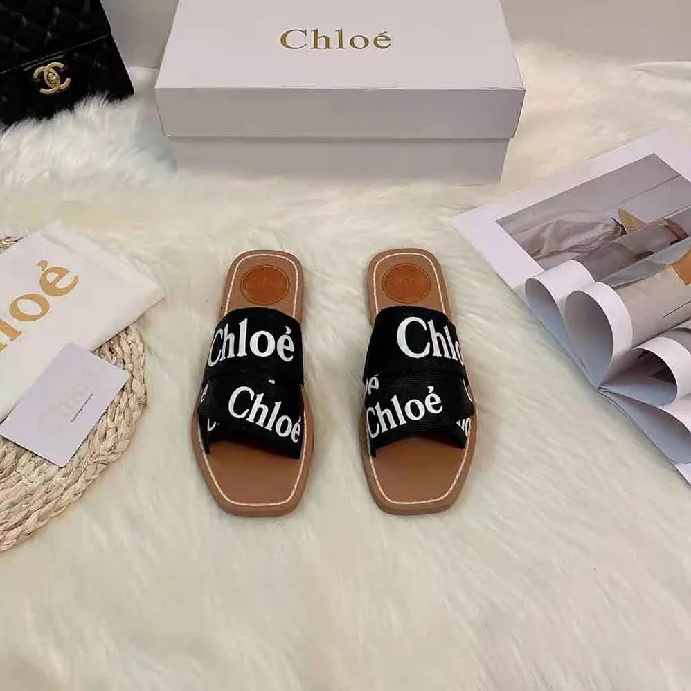 Chloe Woody Flat Mule in Canvas for Women in Black Chloe Woody Flat Mule in Canvas for Women in Black