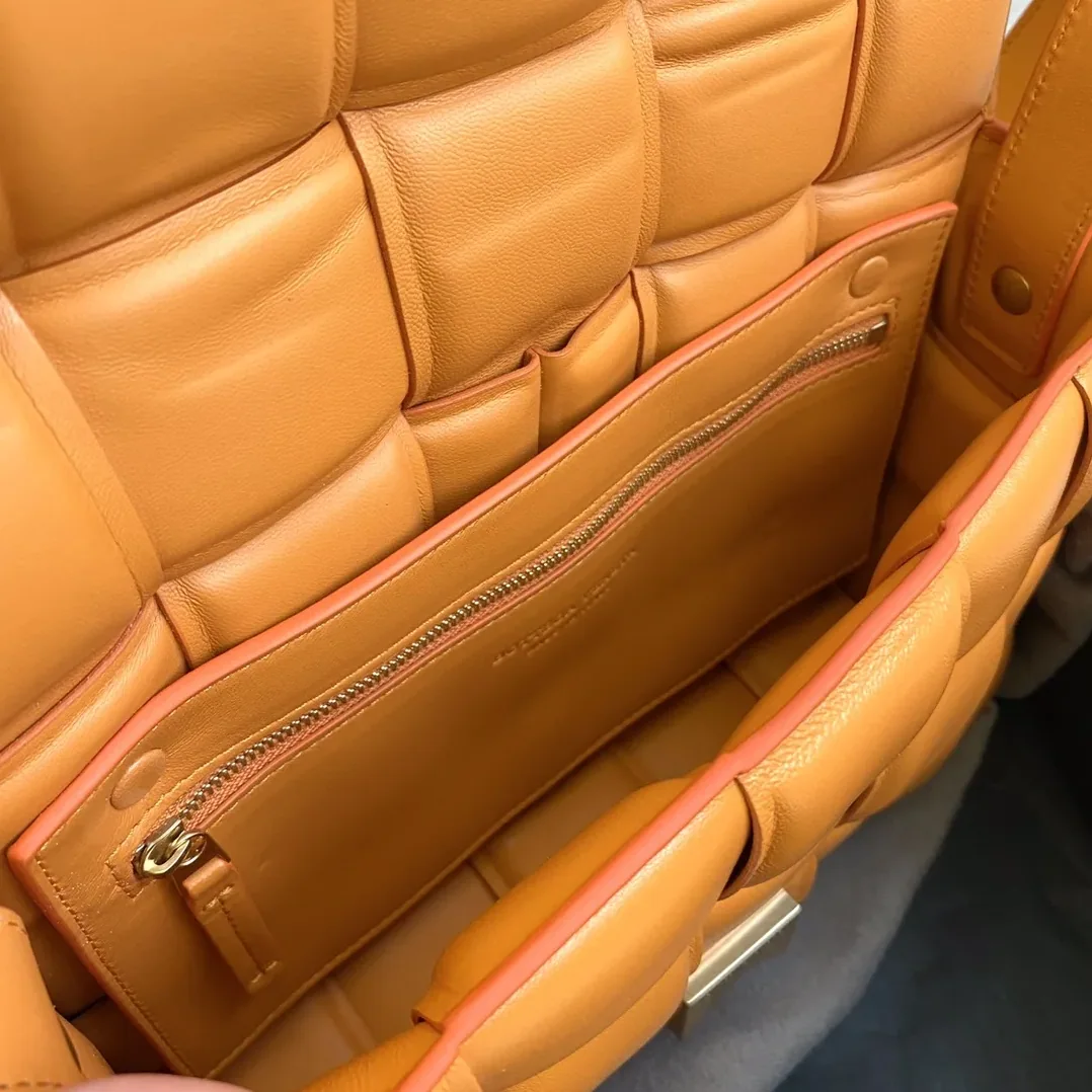 Bottega Veneta Padded Cassette Bag in In Orange