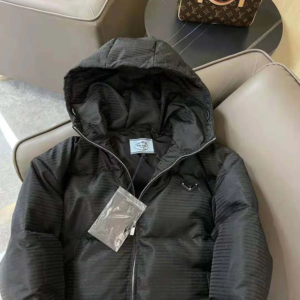 Prada Re-Nylon Hooded Down Jacket for Men in Black Prada Re-Nylon Hooded Down Jacket for Men in Black