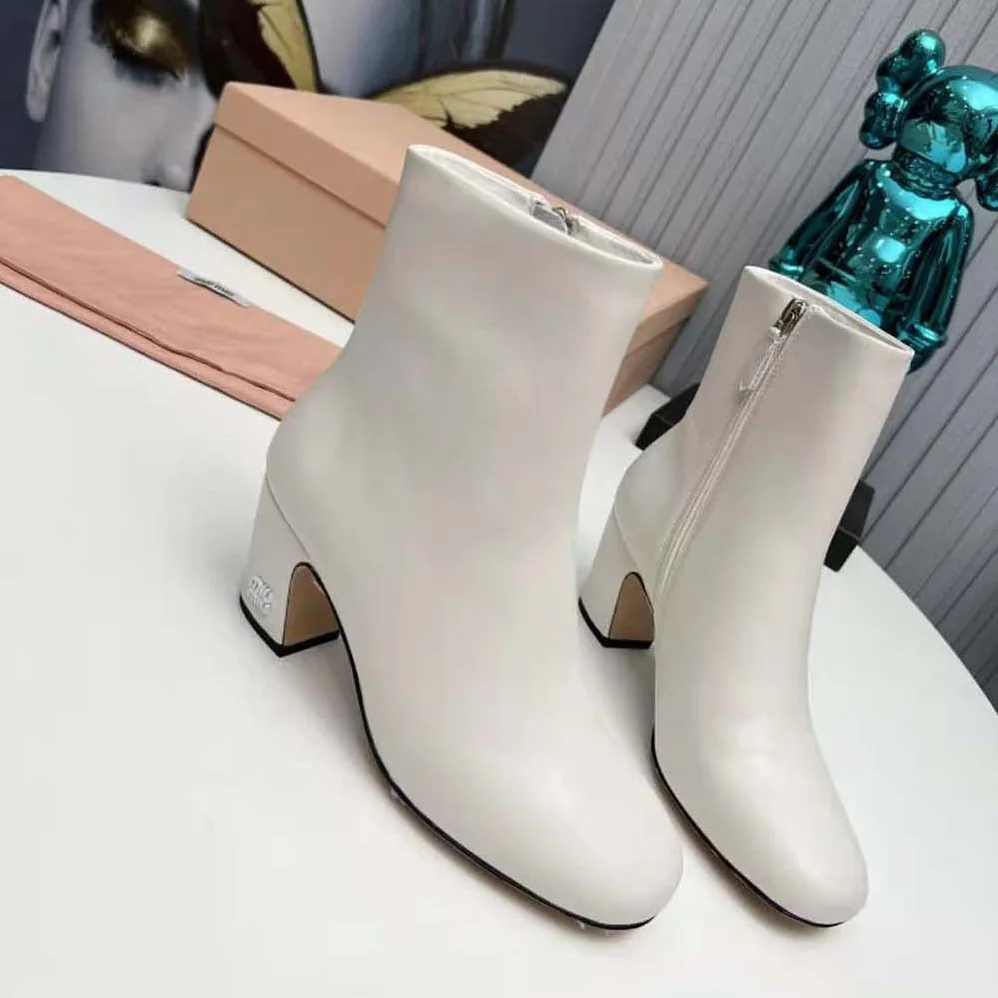 Miu Miu Leather Booties with Metal Lettering Logo for Women in White