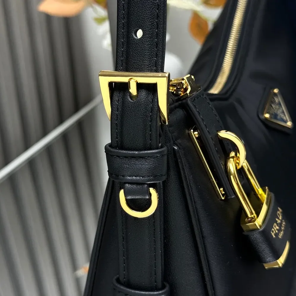 Prada Aimée large Re-Nylon and Leather Shoulder Bag with Padlock for Women Prada Aimée large Re-Nylon and Leather Shoulder Bag with Padlock for Women