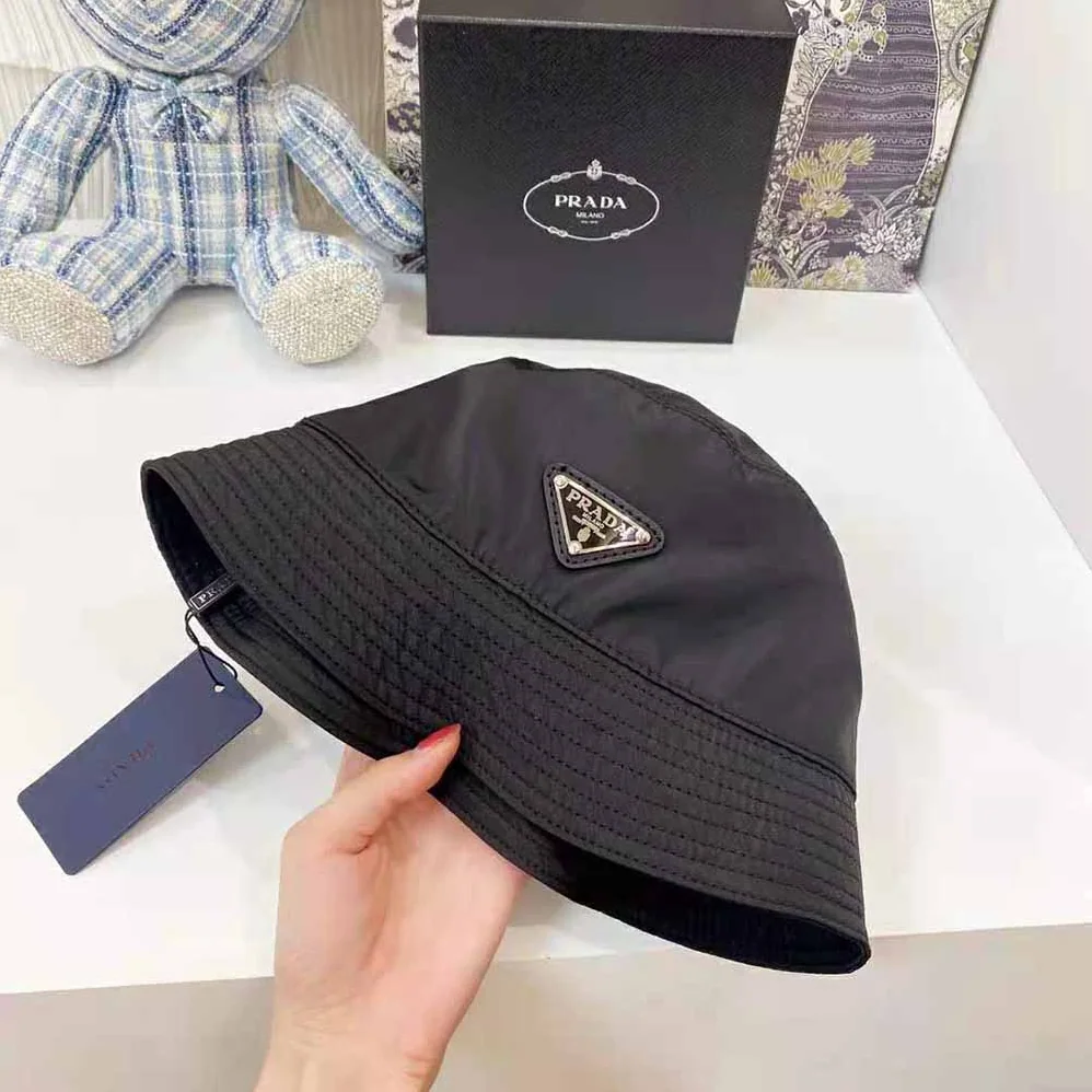 Prada Nylon Bucket Hat Decorated with the Triangle Logo for Women in Black Prada Nylon Bucket Hat Decorated with the Triangle Logo for Women in Black