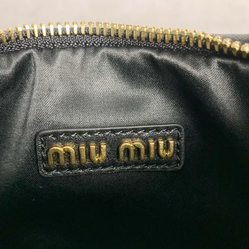Miu Miu Wander Matelassé Nappa Leather Hobo Bag for Women in Black Miu Miu Wander Matelassé Nappa Leather Hobo Bag for Women in Black