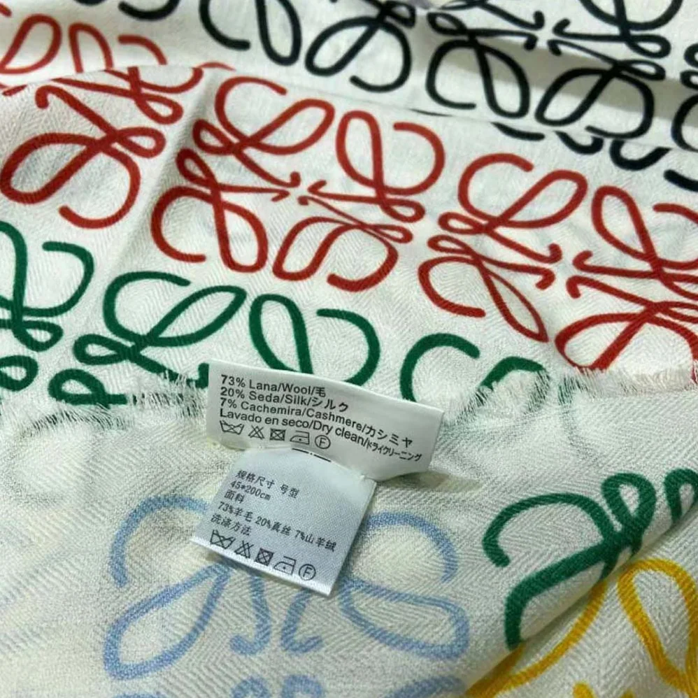 Loewe Anagram Lines Scarf in Wool and Cashmere for Women in White Loewe Anagram Lines Scarf in Wool and Cashmere for Women in White