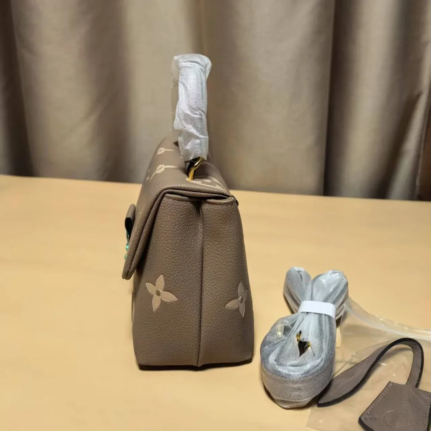 Louis Vuitton Madeleine BB Monogram Empreinte Dove Gray in Creme Beige