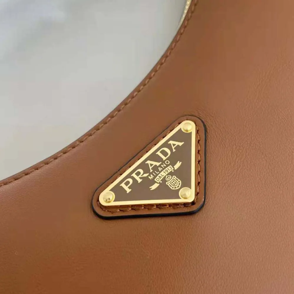 Prada Leather Shoulder Bag with Enameled Metal Triangle Logo for Women in Brown Prada Leather Shoulder Bag with Enameled Metal Triangle Logo for Women in Brown
