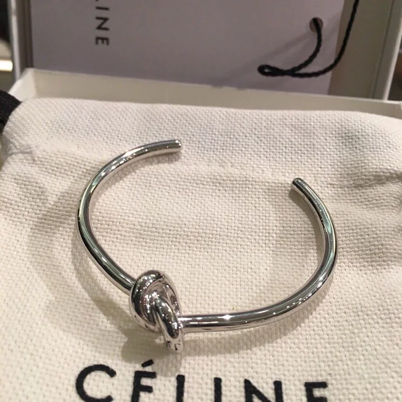 Celine Knot Extra-Thin Bracelet in Brass with Rhodium Finish for Women in Silver Celine Knot Extra-Thin Bracelet in Brass with Rhodium Finish for Women in Silver