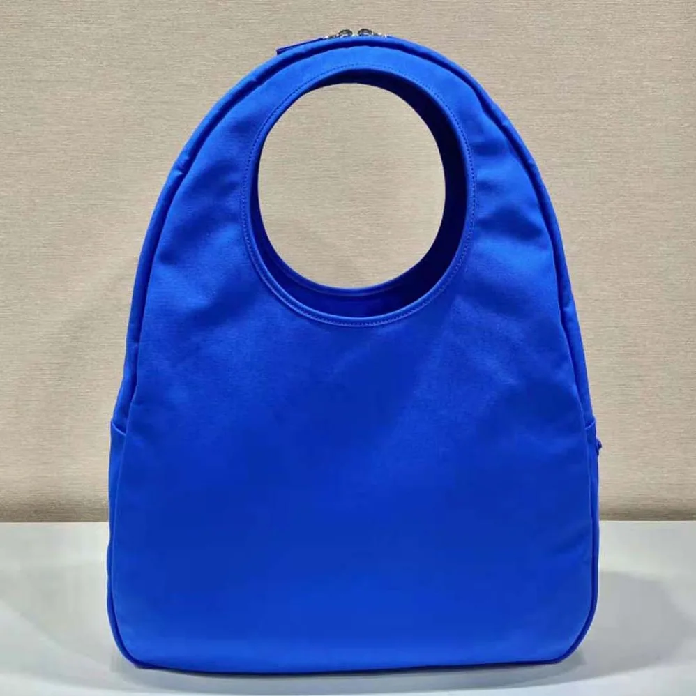 Prada Canvas Hobo Bag with Embossed Logo on the Front for Men in Blue Prada Canvas Hobo Bag with Embossed Logo on the Front for Men in Blue