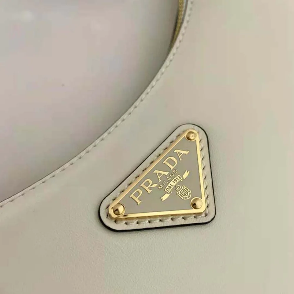 Prada Leather Shoulder Bag with Enameled Metal Triangle Logo for Women in White