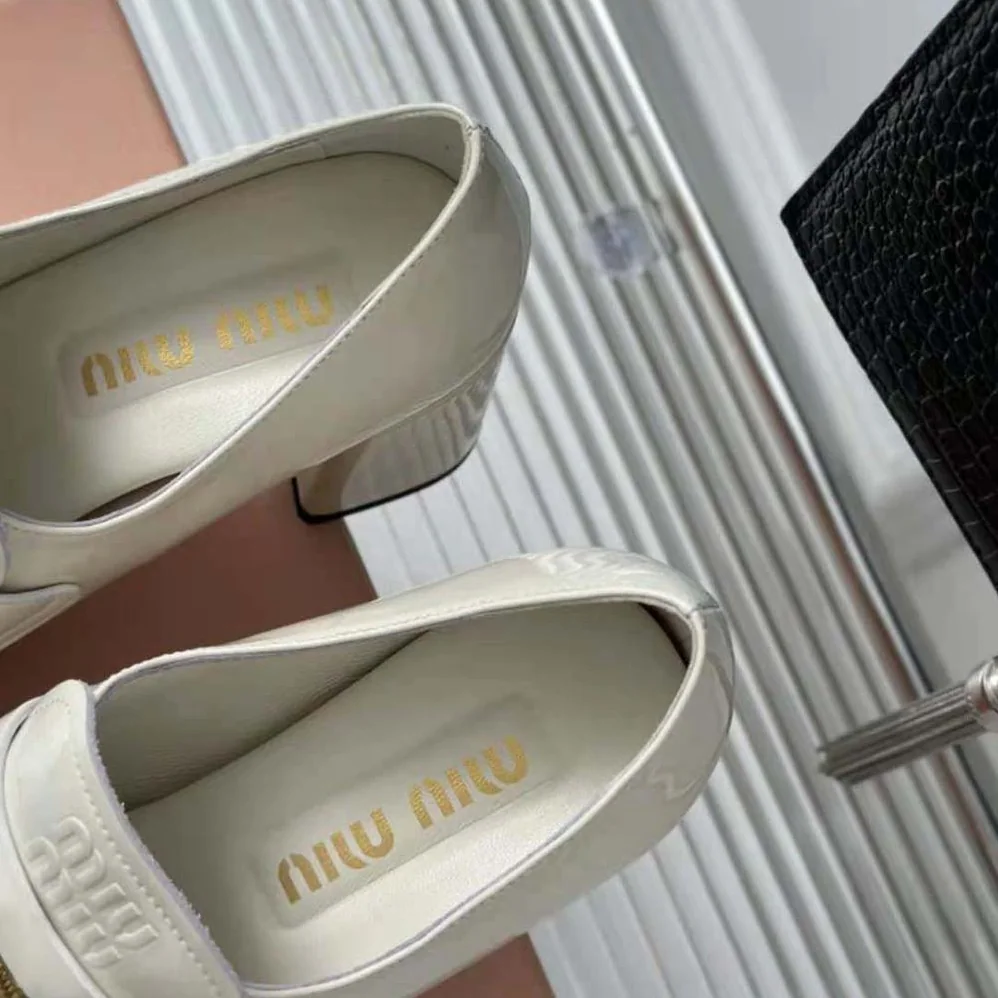 Miu Miu Patent Leather Loafers with Embossed Logo on the Tongue for Women in White Miu Miu Patent Leather Loafers with Embossed Logo on the Tongue for Women in White