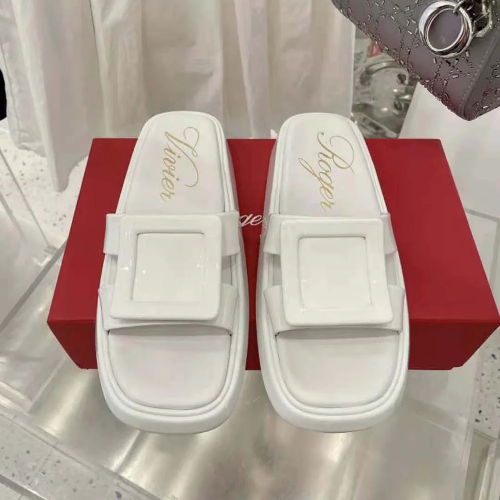 Roger Vivier Vivier Slide Covered Buckle Mules in Patent Leather for Women in White Roger Vivier Vivier Slide Covered Buckle Mules in Patent Leather for Women in White