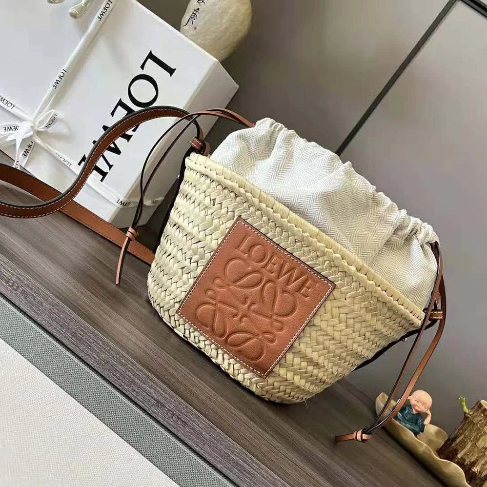 Loewe Drawstring Bucket Bag in Palm Leaf and Calfskin for Women in Brown Loewe Drawstring Bucket Bag in Palm Leaf and Calfskin for Women in Brown