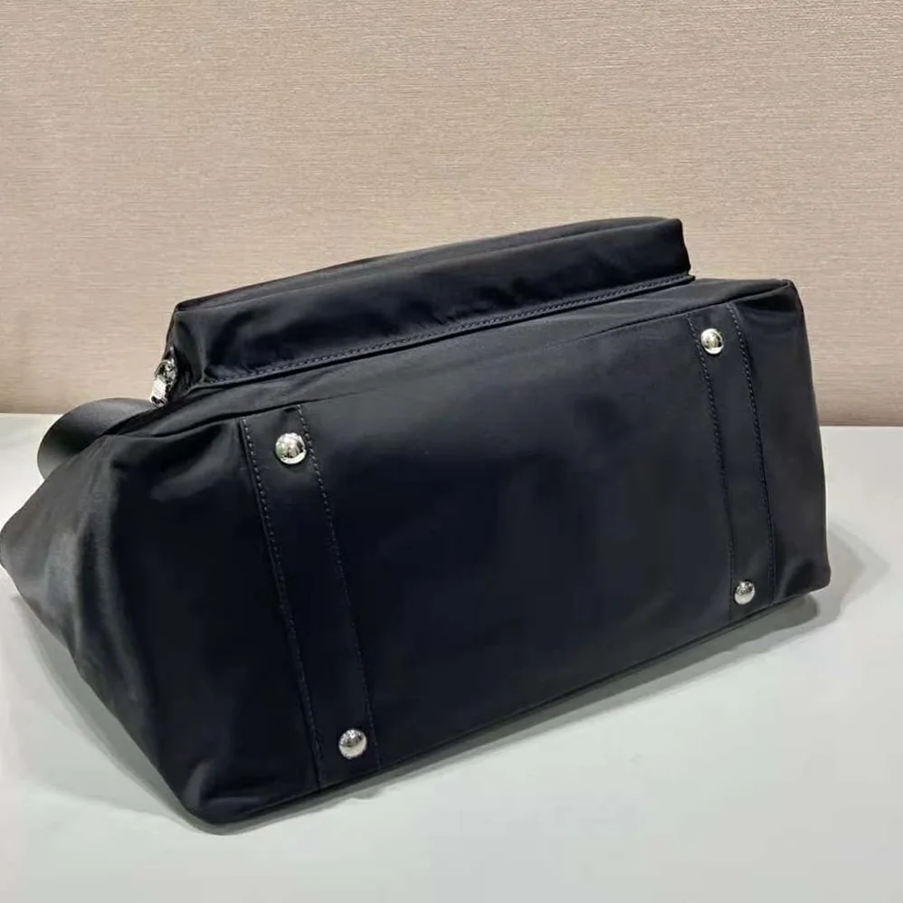 Prada Re-Nylon Baby Bag with Re-Nylon logo-Print lining for Women in Black
