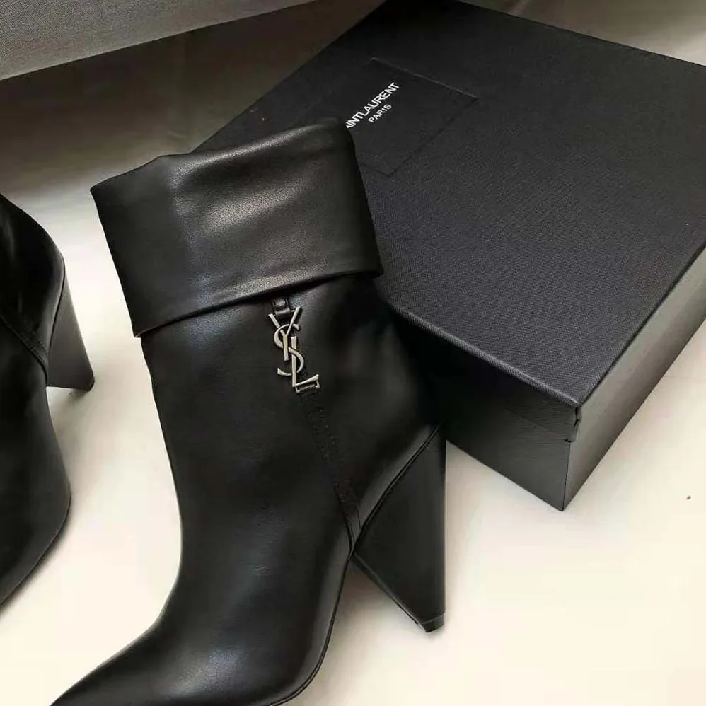 Saint Laurent YSL Niki Booties in Smooth Leather and Silver-Tone Monogram for Women in Black Saint Laurent YSL Niki Booties in Smooth Leather and Silver-Tone Monogram for Women in Black