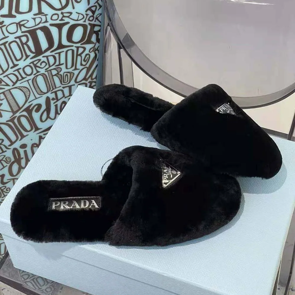 Prada Enameled Triangle Logo Accentuates Shearling Sabots for Women