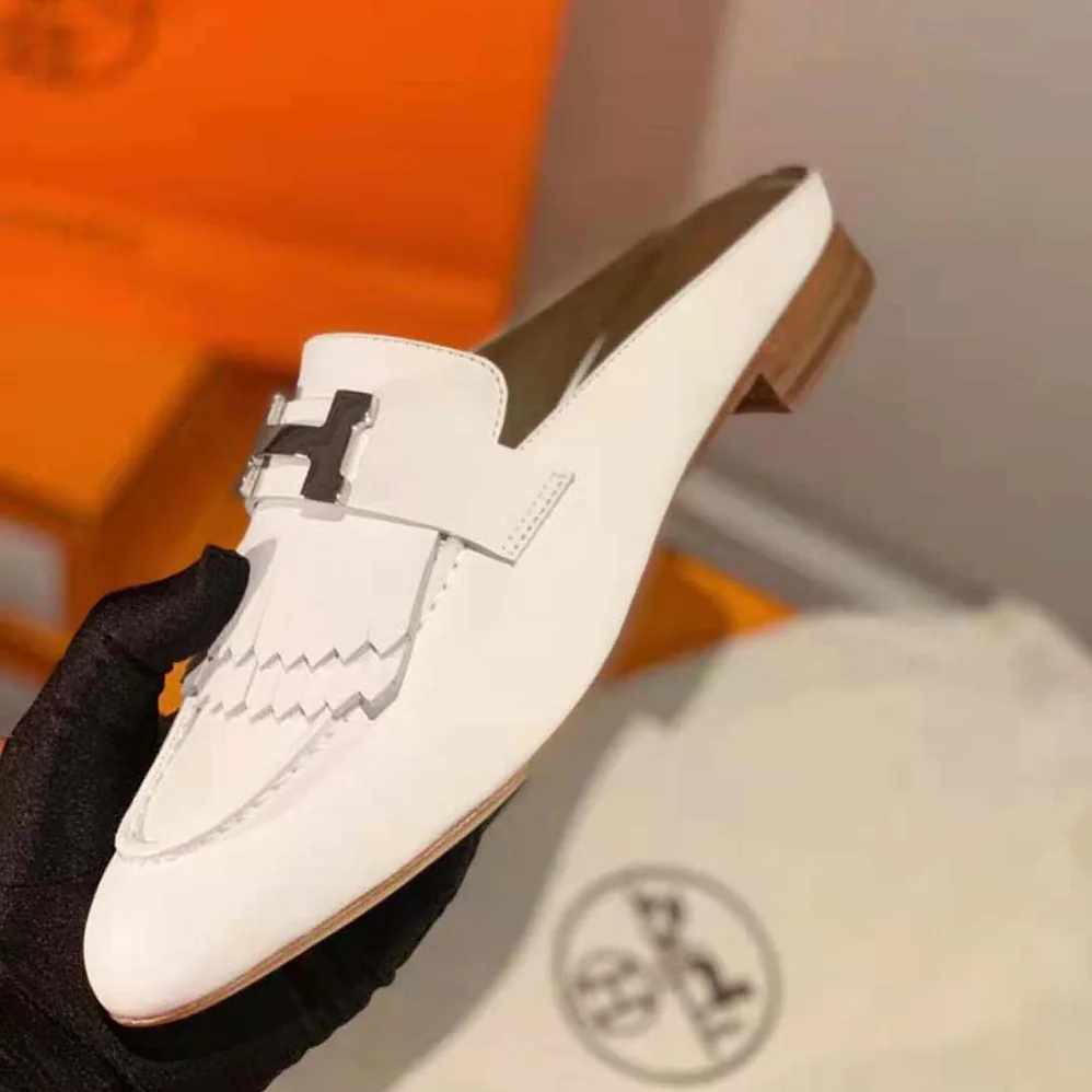 Hermes Rivoli Mule Mule in Calfskin with Fringe Detail for Women in White Hermes Rivoli Mule Mule in Calfskin with Fringe Detail for Women in White
