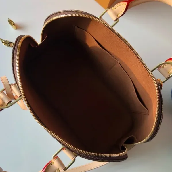 Louis Vuitton Alma PM Top Handle Bag in Brown Gold Hardware