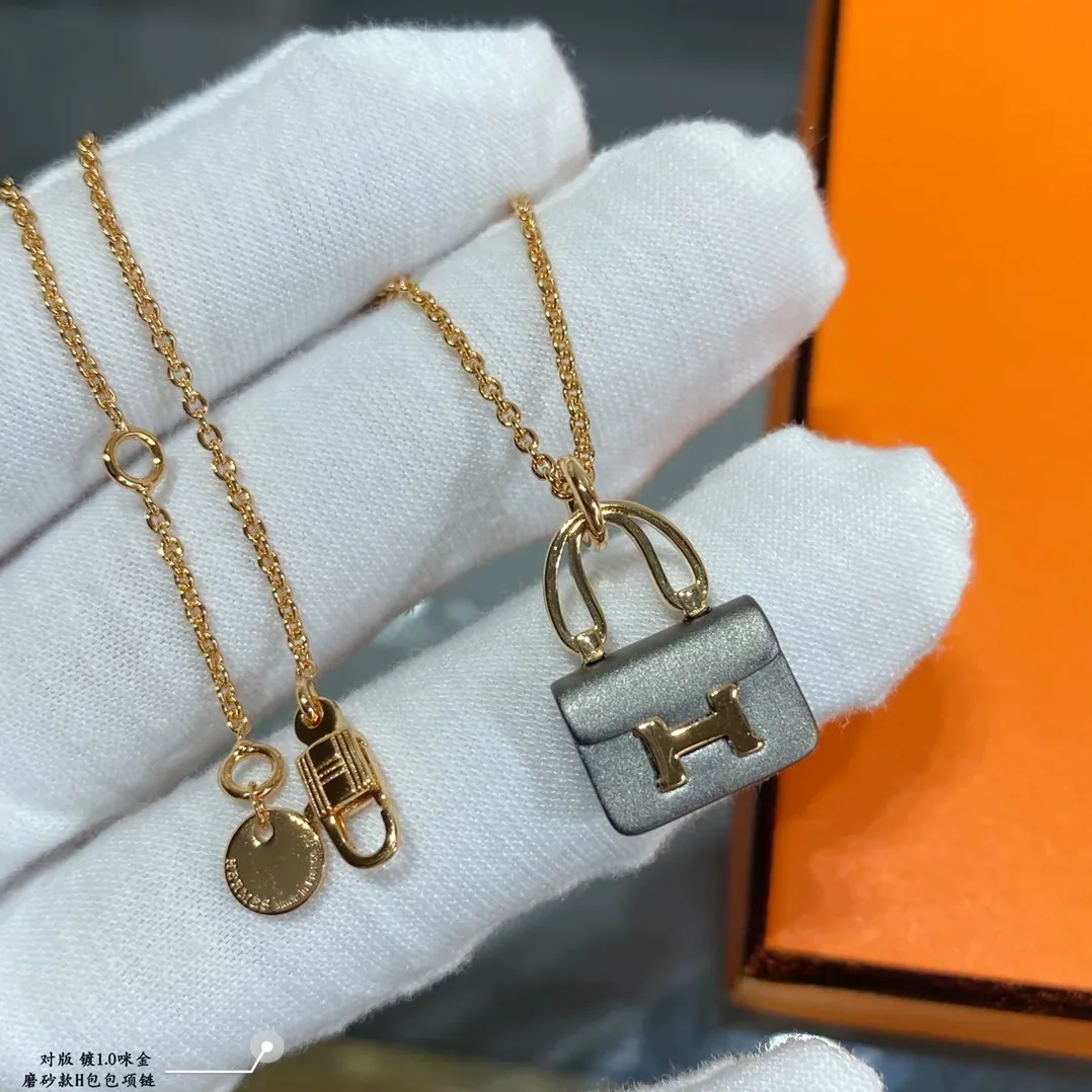 Hermes Constance Amulets Pendant Necklace Gold Tone Hermes Constance Amulets Pendant Necklace Gold Tone