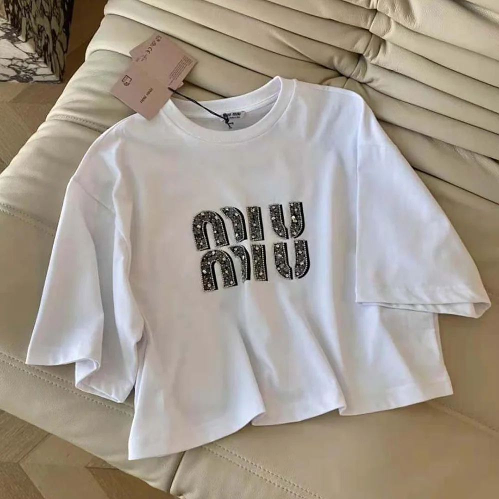 Miu Miu Embroidered Cotton T-shirt with Embroidered Logo for Women in White Miu Miu Embroidered Cotton T-shirt with Embroidered Logo for Women in White