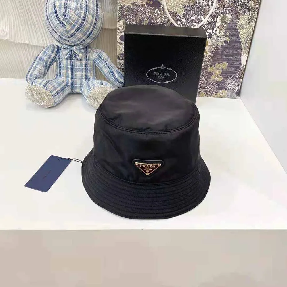 Prada Nylon Bucket Hat Decorated with the Triangle Logo for Women in Black Prada Nylon Bucket Hat Decorated with the Triangle Logo for Women in Black