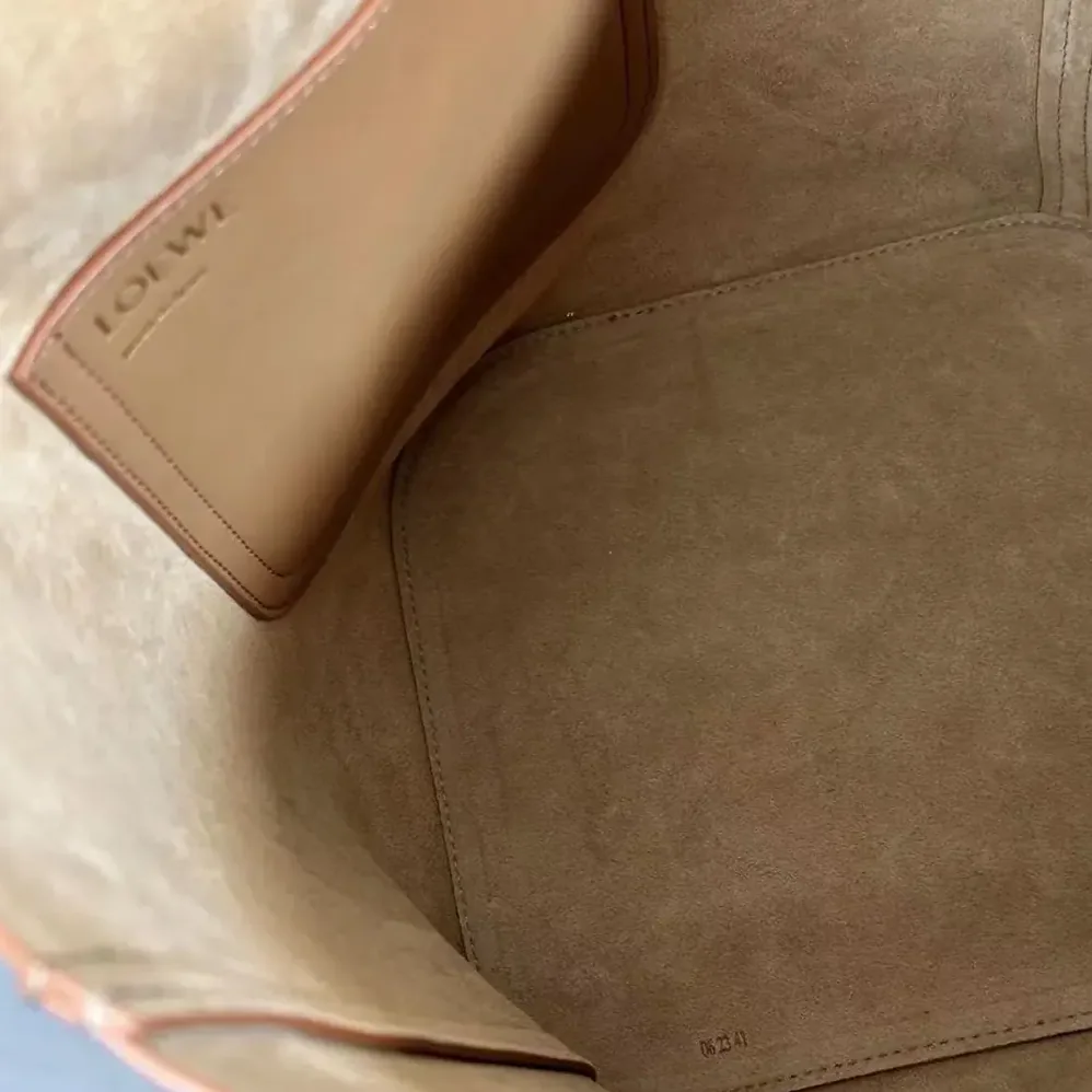 Loewe Medium Pebble Bucket Bag in Mellow Calfskin for Unisex in Brown