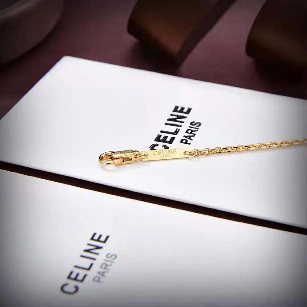 Celine Cœur Celine Charms Bracelet in Brass with Gold Finish and Resin Pearl for Women