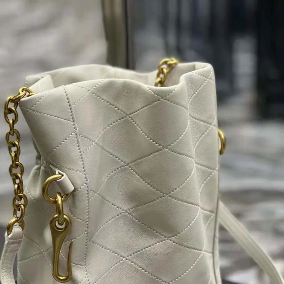 Saint Laurent YSL Le Maillon Hook Bucket Bag in Supple Leather for Women in White Saint Laurent YSL Le Maillon Hook Bucket Bag in Supple Leather for Women in White