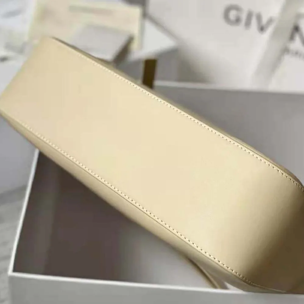 Givenchy Medium Moon Cut Out Bag in Leather for Women in Beige