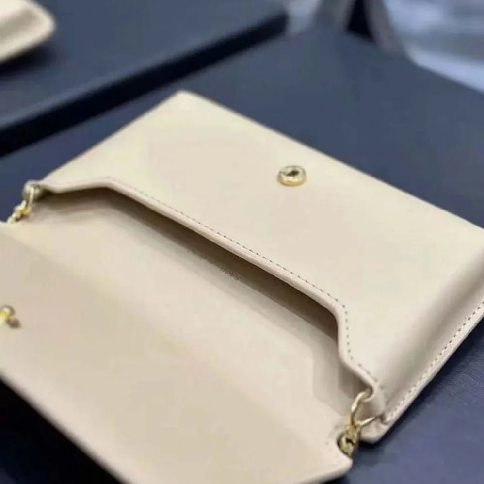 Saint Laurent YSL Cassandre Phone Holder in Smooth Leather for Women in Sandy Saint Laurent YSL Cassandre Phone Holder in Smooth Leather for Women in Sandy