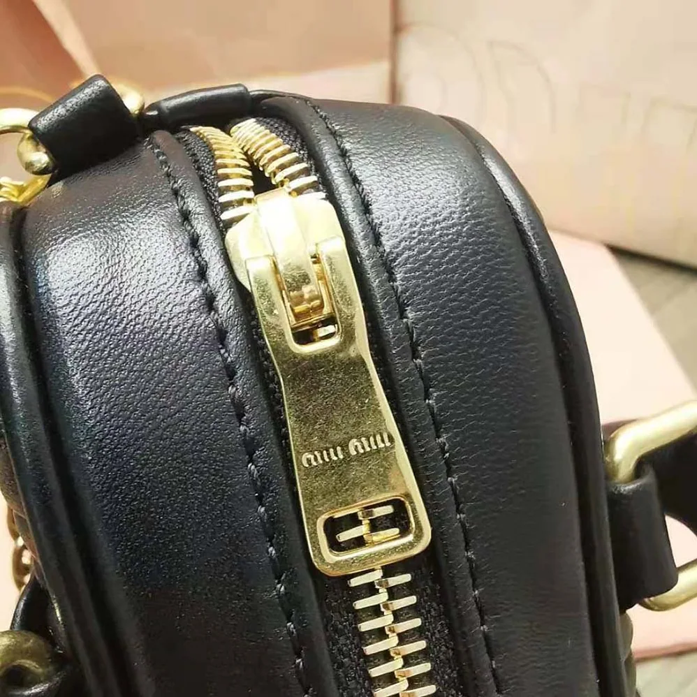 Miu Miu Matelassé Nappa Leather Top-Handle Mini-Bag for Women in Black Miu Miu Matelassé Nappa Leather Top-Handle Mini-Bag for Women in Black