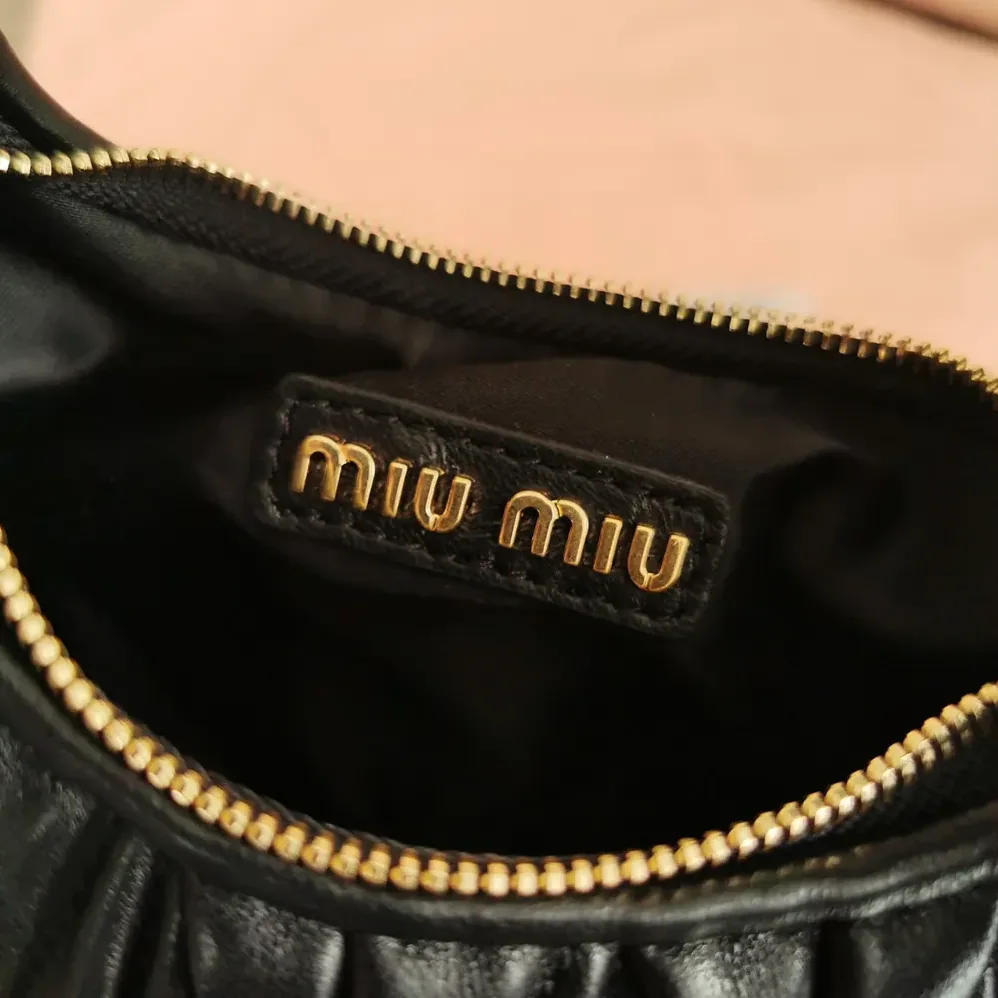Miu Miu Wander Matelassé Nappa Leather Hobo Mini-Bag for Women in Black Miu Miu Wander Matelassé Nappa Leather Hobo Mini-Bag for Women in Black