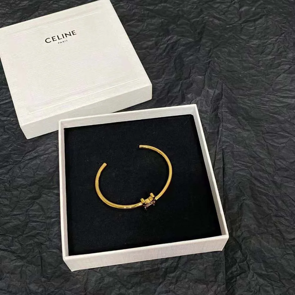 Celine Triomphe Asymmetric Cuff in Brass with Gold Finish for Women Celine Triomphe Asymmetric Cuff in Brass with Gold Finish for Women