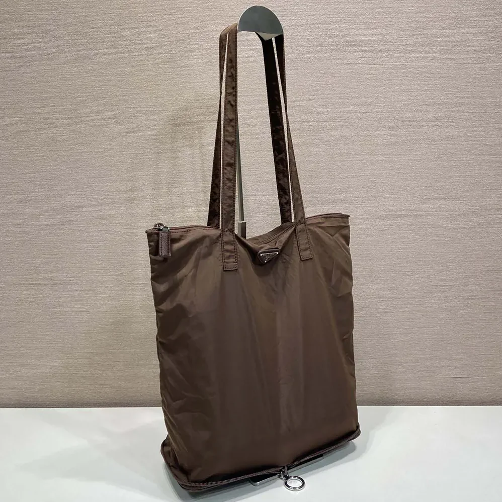 Prada Saffiano Leather Pendant With Re-Nylon Tote Bag for Women in Sienna Prada Saffiano Leather Pendant With Re-Nylon Tote Bag for Women in Sienna