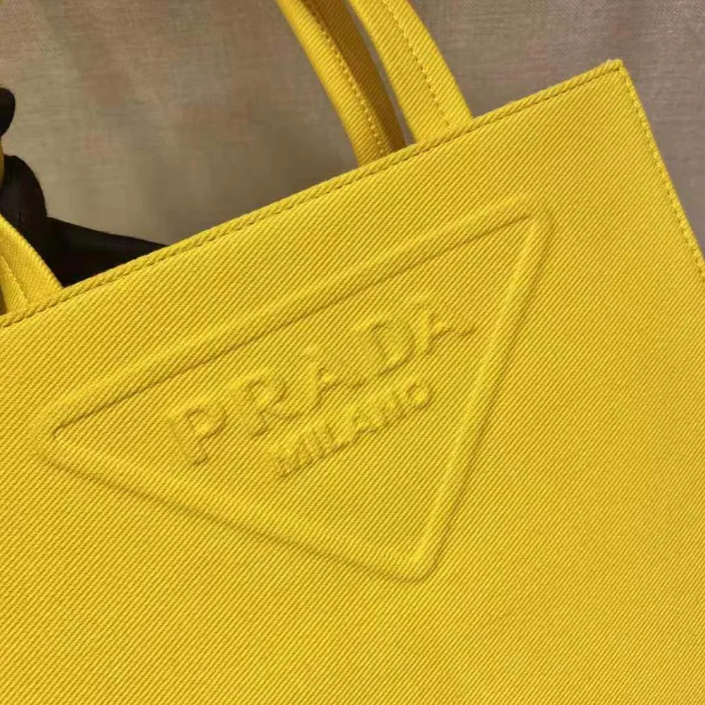 Prada Drill Tote Handles Bag for Women in Yellow Prada Drill Tote Handles Bag for Women in Yellow
