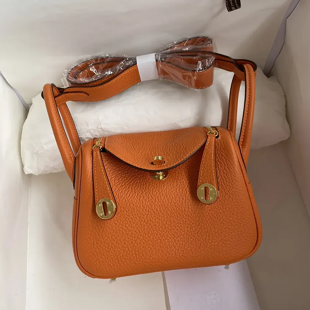 Hermes Lindy Mini 19 in Clemence Leather for Women in Orange/Gold Hermes Lindy Mini 19 in Clemence Leather for Women in Orange/Gold