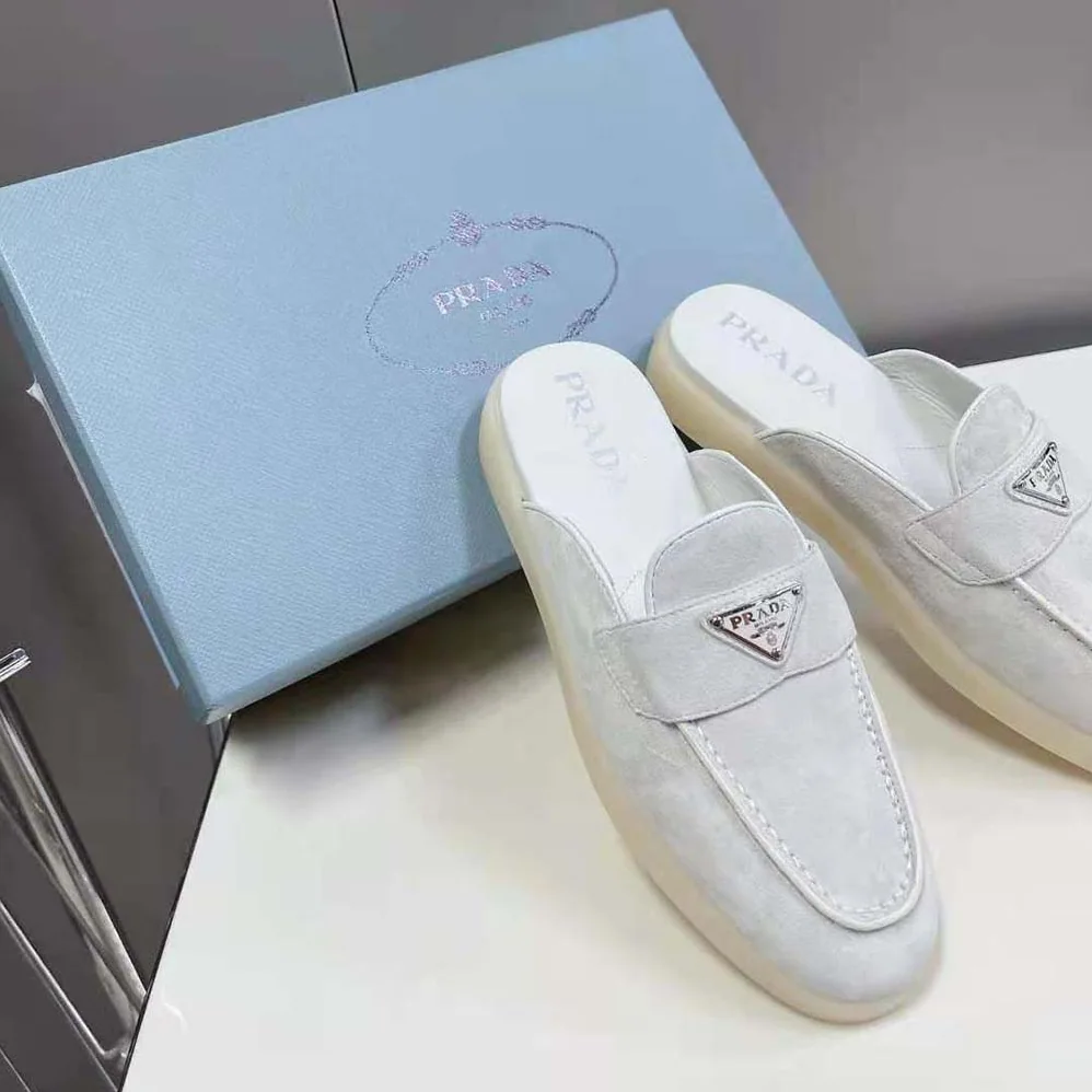 Prada Suede Leather Sabots with Enameled Metal Triangle Logo for Unisex in White