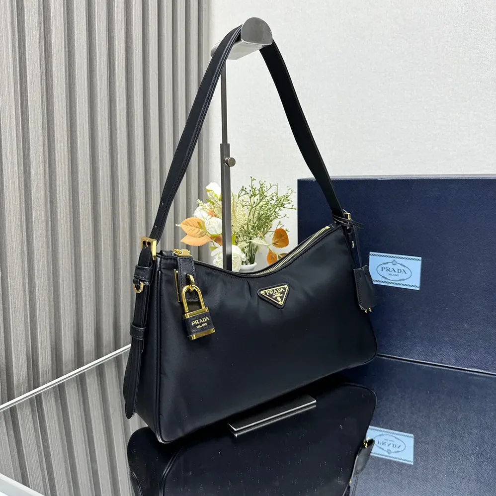 Prada Aimée large Re-Nylon and Leather Shoulder Bag with Padlock for Women Prada Aimée large Re-Nylon and Leather Shoulder Bag with Padlock for Women