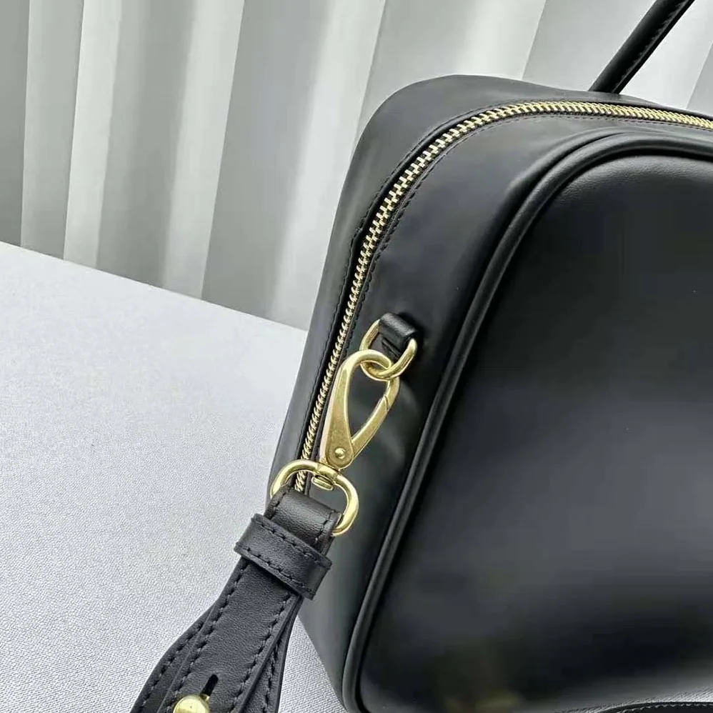 Miu Miu Leather Top-handle Bag with Embossed Lettering Logo for Women in Black Miu Miu Leather Top-handle Bag with Embossed Lettering Logo for Women in Black