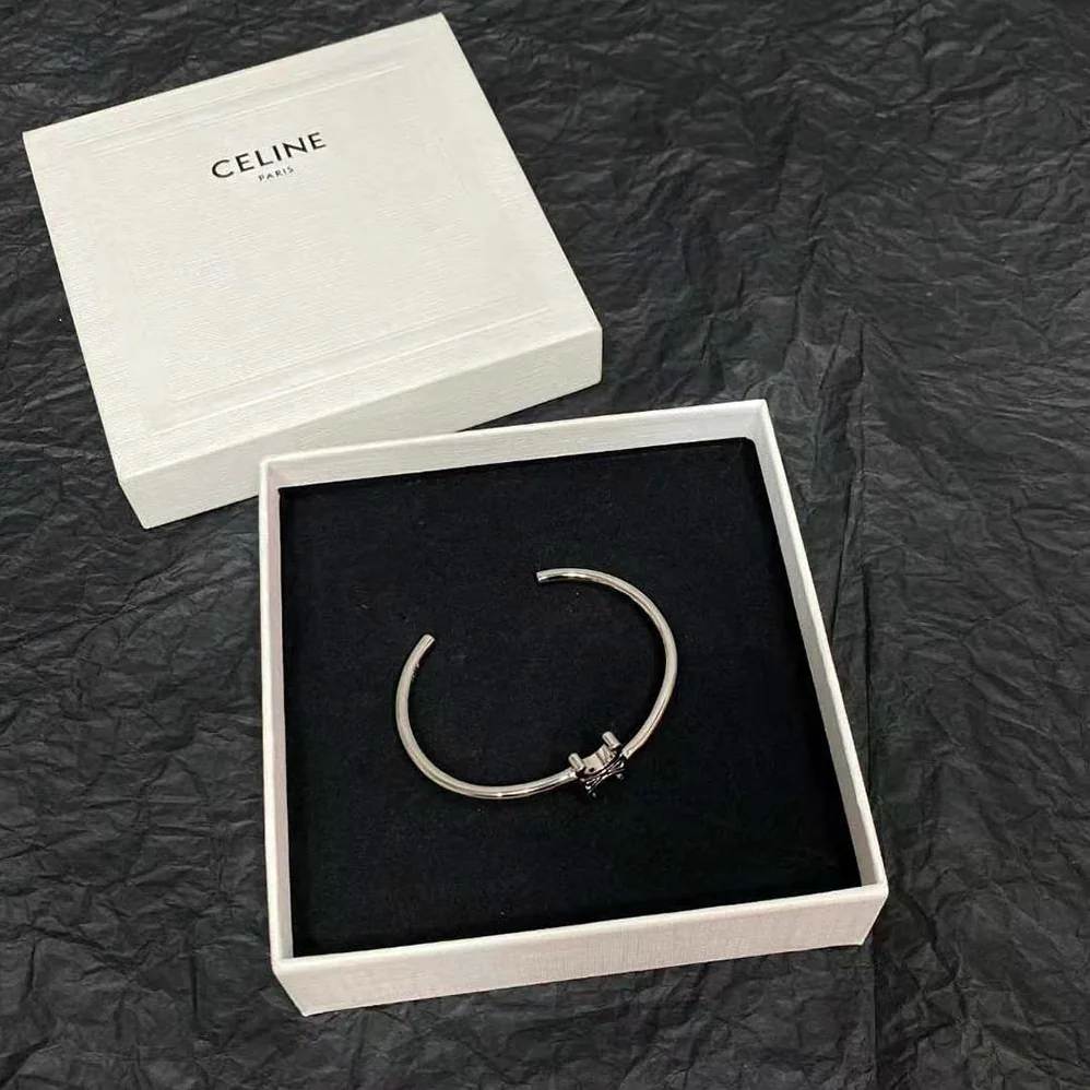 Celine Triomphe Asymmetric Cuff in Brass with Rhodium Finish for Women