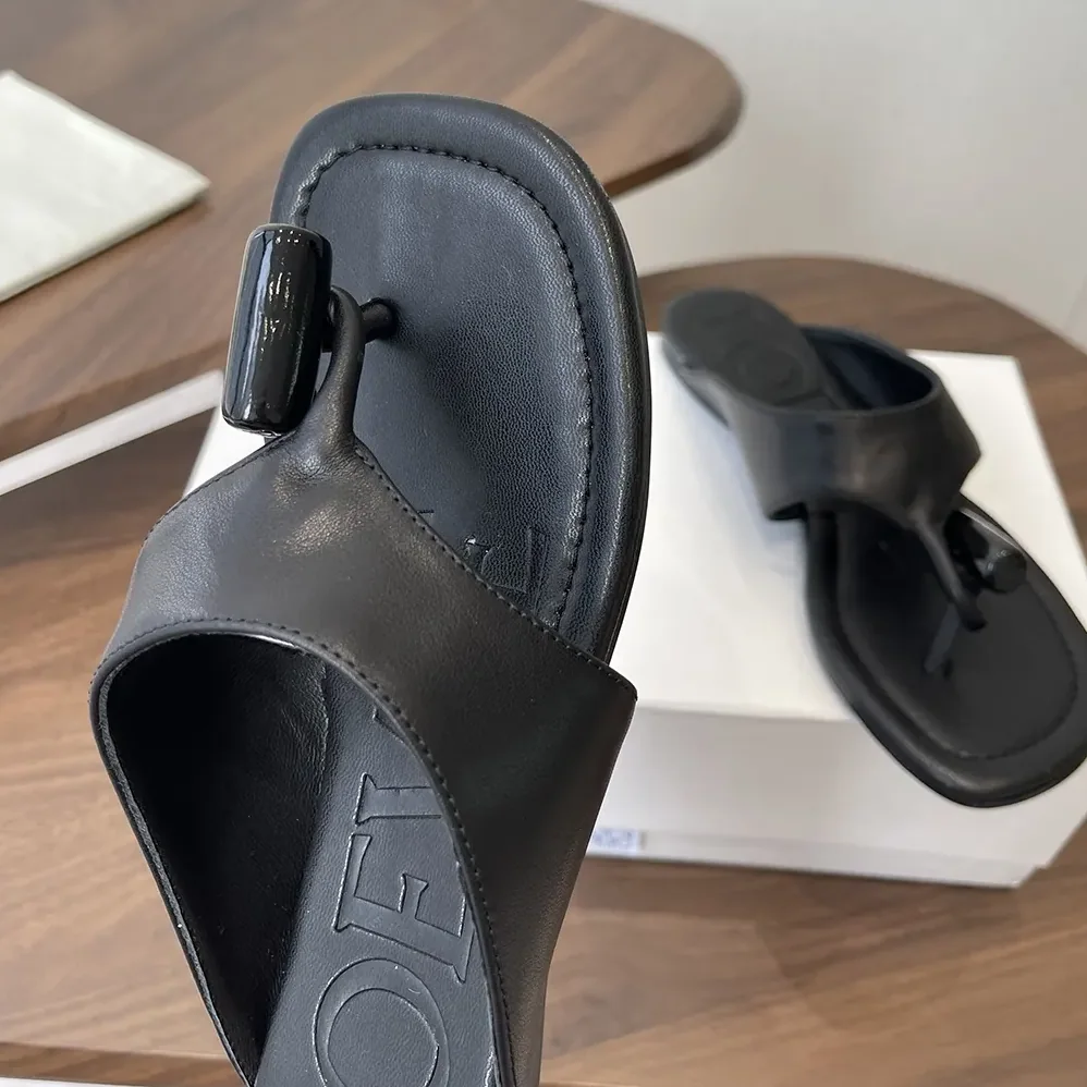 Loewe Toggle Flat Sandal in Shiny Smoot Calfskin for Women in Black Loewe Toggle Flat Sandal in Shiny Smoot Calfskin for Women in Black
