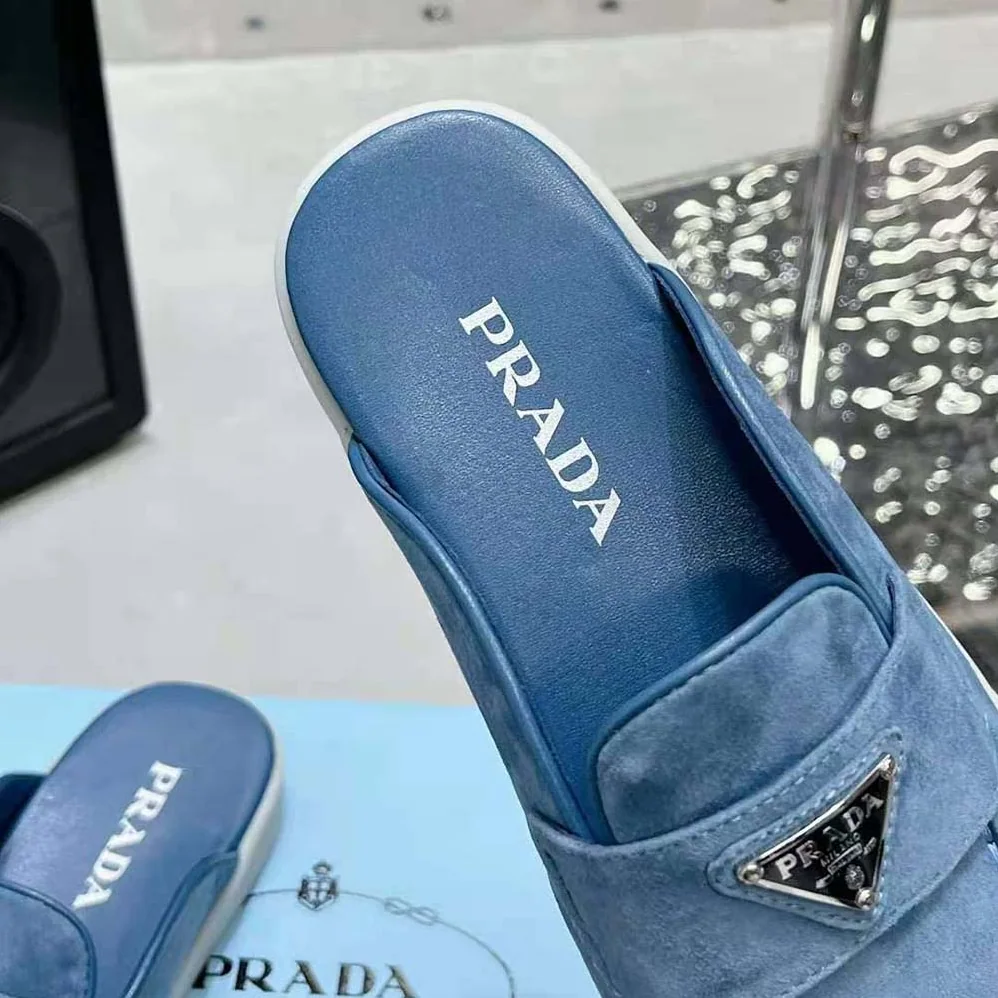 Prada Suede Sabots with the Enameled Metal Triangle Logo for Men