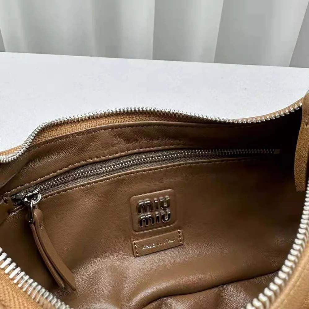 Miu Miu Pocket Nappa Leather Bag with Embossed Lettering Logo for Women in Brown Miu Miu Pocket Nappa Leather Bag with Embossed Lettering Logo for Women in Brown