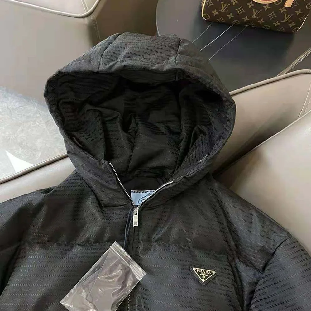Prada Re-Nylon Hooded Down Jacket for Men in Black Prada Re-Nylon Hooded Down Jacket for Men in Black