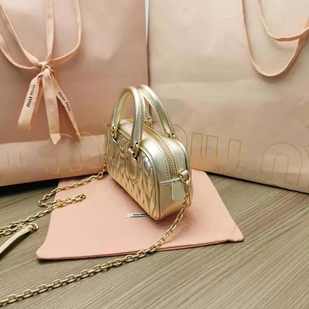 Miu Miu Matelassé Nappa Leather Top-Handle Mini-Bag for Women in Gold