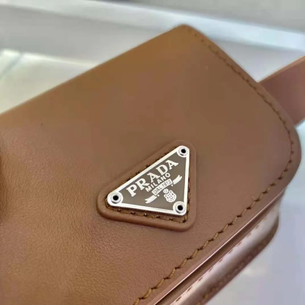 Prada Leather Belt With a Hybrid Multifunctional Design for Women in Brown Prada Leather Belt With a Hybrid Multifunctional Design for Women in Brown