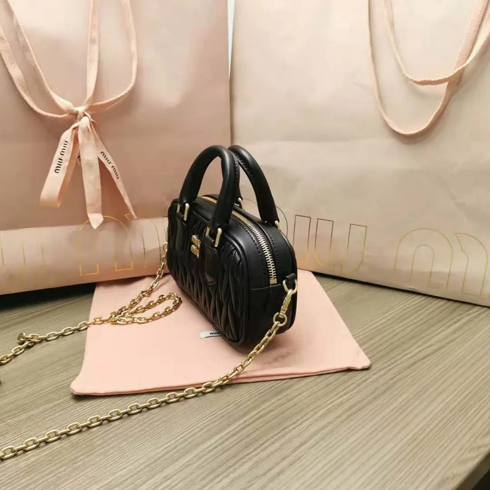 Miu Miu Matelassé Nappa Leather Top-Handle Mini-Bag for Women in Black Miu Miu Matelassé Nappa Leather Top-Handle Mini-Bag for Women in Black
