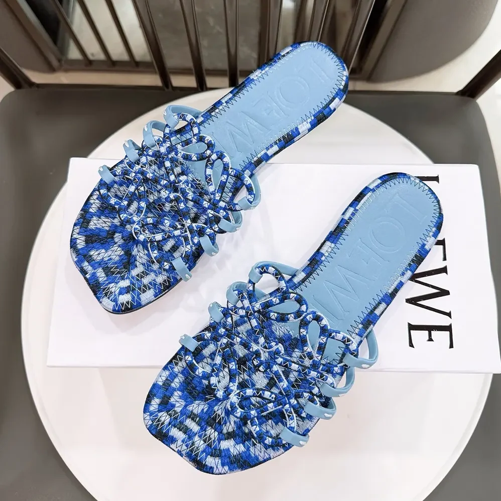 Loewe Petal Anagram Slide in Embroidered Canvas for Women in Baby Blue Loewe Petal Anagram Slide in Embroidered Canvas for Women in Baby Blue